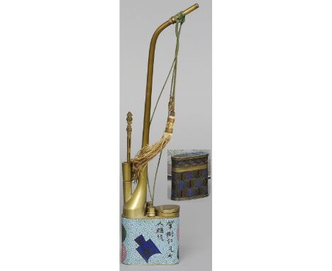A Chinese cloisonne opium pipe
Of typical form, decorated with bi disks and calligraphic script; together with a Chinese cham
