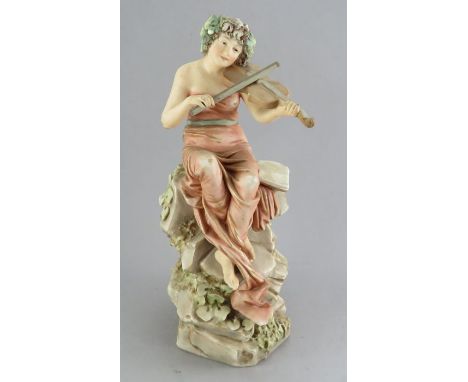 A Royal Dux figure of a young lady seated playing a violin Date  late 19th century  pink triangle Size  30cm highCondition   