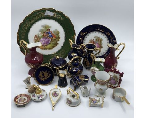 A collection of 20th century ceramic Limoges items, including:- two different size plates, an assortment of small jugs and va