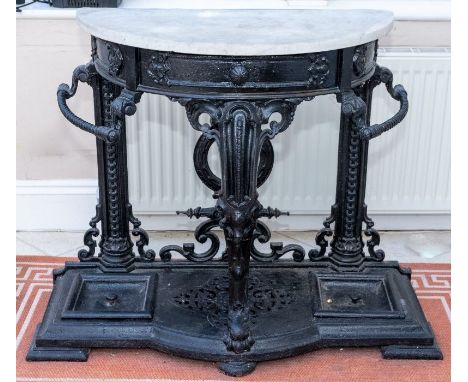 A large and impressive late 19th century cast iron Coalbrookdale hall stand, demi-lune marble top, above one frieze draw, one