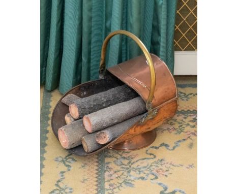 A copper and brass handled early 20th century coal scuttlePlease note this item is at an offsite location, buyers will be not