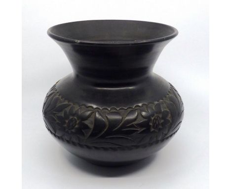 A ceramic vase with a band of flowers 18.5 cm high Minor flakes to top edge