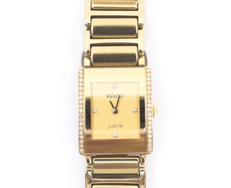 A RADO Lady's gilt metal diamond set integral&nbsp;jubile quartz watch, the dial inscribed 'jublie'.