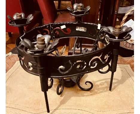 A 20th Century cast iron chandelier, hanging chains suspending a circular body applied with four foliage sconces.