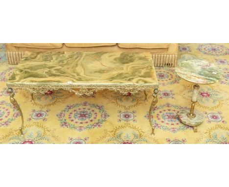 An early 20th century coffee table, rectangular green onyx top raised on ornate brass supports 46cm H x 101cm W x 51cm D, tog