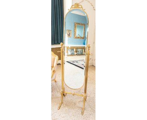 A mid 20th century gilt metal mirror, movable mirror, the supporting columns mounted with acorn finials, 153cm highPlease not