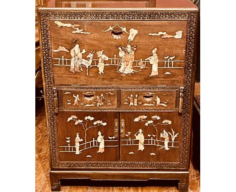 An early 20th century chinoiserie hardwood cocktail cabinet, caddy top over foliage frame, centre with an oriental scene moun