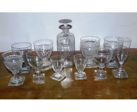 An early 19th C glass decanter with an engraved letter R , and a group of square base glasses (11)some chips around the top r