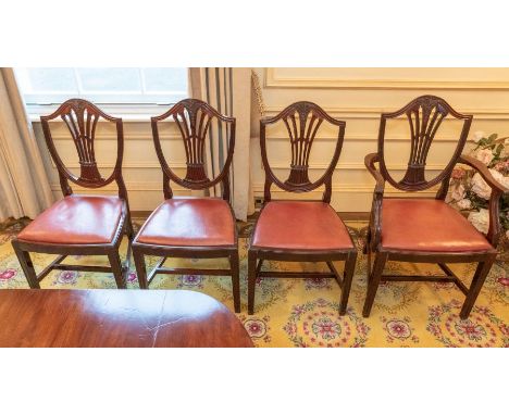 A set of eight mahogany Sheraton style dining room chairs including two carvers, pierced splats with bow fronted seats with l