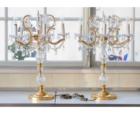 A pair of mid 20th century six branched gilt metal and glass candelabras, 70cm tall (2)Please note this item is at an offsite