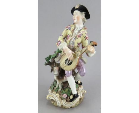 A Meissen Figure of a Minstrel, playing a mandolin with a dog at his sideDate   mid 19th centurySize 19cm highCondition   min