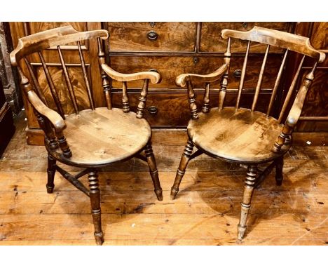 A pair of late 19th century mahogany spindle back chairs, in the manner of comb back Windsor chair, comb rail on spindles uni