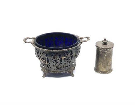 A large silver condiment dish with glass liner, pierced design raised on flur-de-lis feet, Birmingham (date mark rubbed), tog