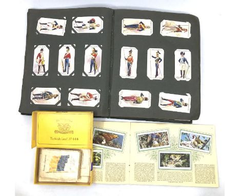 A collection of cigarette cards, including completed albums; the sea-shore; Birds &amp; their young; a large album with vario