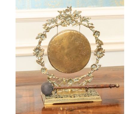 A mid 20th century cast metal gong, foliate decoration on a pierced base 32cm highPlease note this item is at an offsite loca