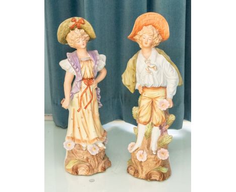 A pair of late 19th century Germain ceramic figures, a male and female, 39cm & 38cm tallPlease note this item is at an offsit