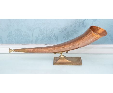 A brass mounted copper and brass horn, 51cm longPlease note this item is at an offsite location, buyers will be notified of t
