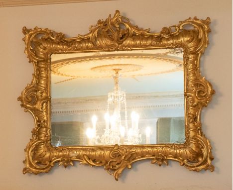 A 19th century giltwood  mirror, in a rococo manner, the mirror plate with some discolouration 96cm H x 117cm WPlease note th