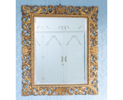 A 19th century gilt wood rococo style mirror, later beveled mirror plate, 100cm x 88cm Please note this item is at an offsite