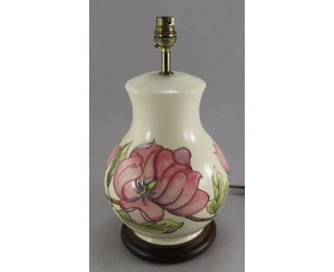 A twentieth century Moorcroft vase-shaped lamp decorated with magnolia. 36 cm tall. (1)Condition: in good condition