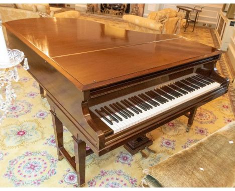 An early 20th century mahogany Grand Piano by C. Bechstein of Berlin, raised on tapered supports terminating in brass castors