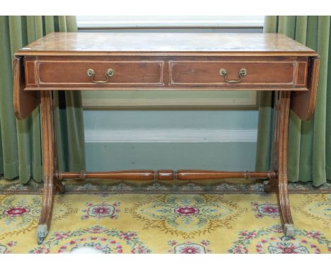 A 19th century walnut drop leaf sofa table with boxwood inlay, the moulded top of rectangular shape with rounded corners, two