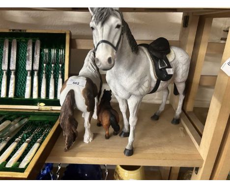 Three various model horses