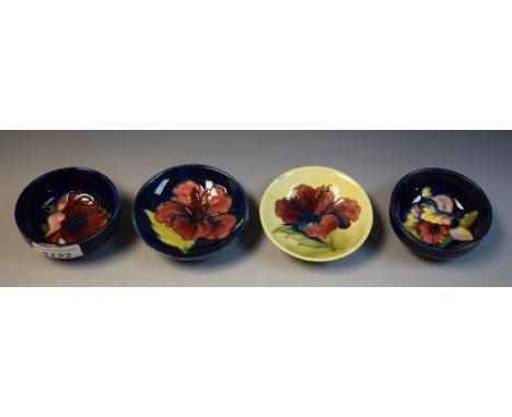 Moorcroft - a Spring Flowers pattern circular trinket dish;  another Anemone;  others similar Hibiscus, all with paper labels