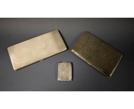 A silver cigarette case, engine turned, Chester; a silver matchbox case; another leather covered cigarette case (3)