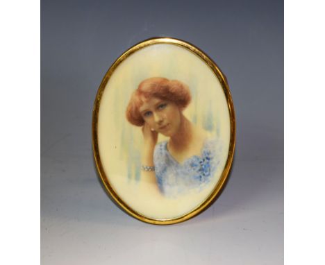 English School, early 20th century, a portrait miniature, of a young lady wearing a blue dress, oval, watercolour on ivory, o