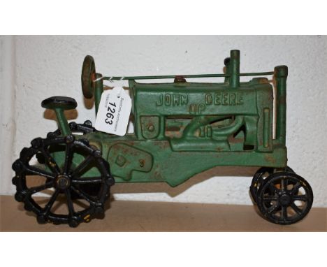 A vintage cast iron John Deere model tractor