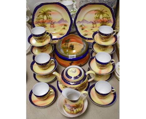 A desert scene tea service, to include 12 cups, saucers, plates, teapot and stand, jug, fruit bowl; etc.