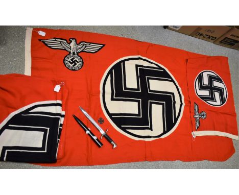 A Nazi German style flag, swastika emblem on red ground, 100cm x 160cm approx.; another, similar, 90cm x 160cm; another, 48cm