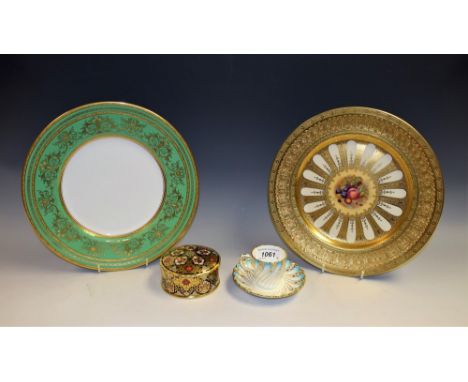 An Aynsley cabinet plate, the centre printed with ripe fruit within a raised gilt border, 26.5cm diameter; a Mintons spirally