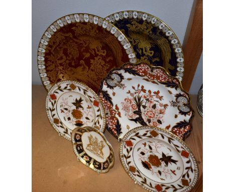A Royal Crown Derby plate, Gold Aves on a cobalt blue ground, heraldic border; another with Gold Aves on a red ground; a shap