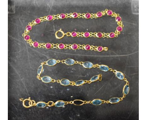 Jewellery - a ruby and yellow metal fancy link bracelet, inset with round cut pinky red rubies, stamped 750 to loop clasp; an