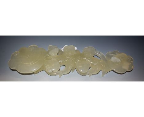 A Chinese celadon jade effect lotus carving, 36cm long