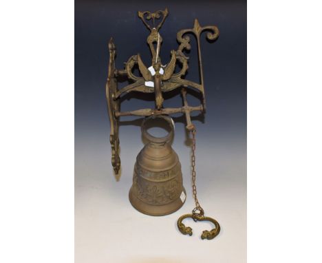 A cast brass church type wall mounting bell, cast ornate band beneath Latin script "Vocem meam audi, qui me tangit", which tr