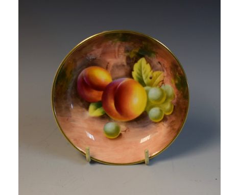 A Royal Worcester pin dish,  signed, with ripe fruit on a mossy ground, 11cm diam, printed crown and circle mark in black  Co