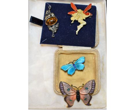 A Sterling silver Art Nouveau butterfly enamel brooch; three others, similar