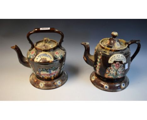 A Victorian Measham Bargeware teapot on stand, Love At Home 1886, 23cm high overall; another Bargeware tea kettle on stand, A