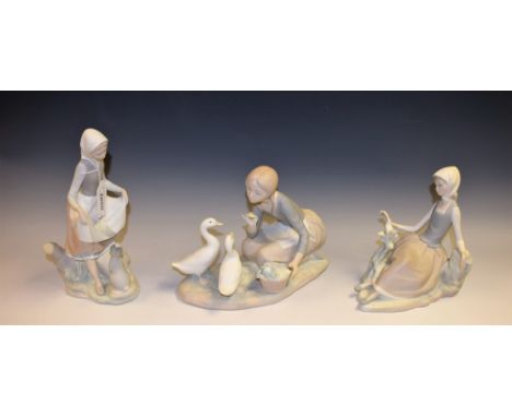 A Lladro figure group, Food For Ducks, matte finish; others, Shepherdess With Dove, Rabbit's Food (3)