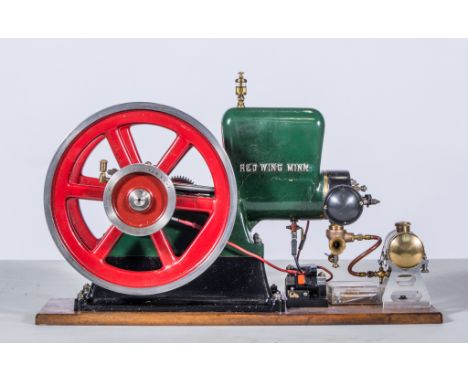 Stationary horizontal model engine "Red Wing co", built by Mr William Linfield, mounted on wooden base, with twin 8 inch spok