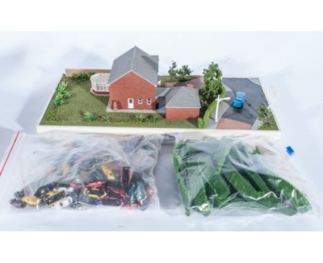 Scale architects model house on base, 1:75 scale, with a selection of model spares, trees, vehicles, accessories etc, 40.5cm 