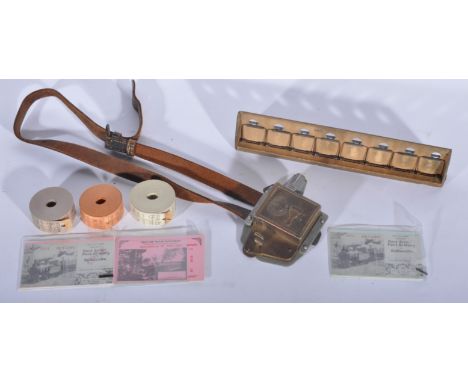 Bus Conductor's ticket machine, with ticket rolls and clipboard and individual tickets.  