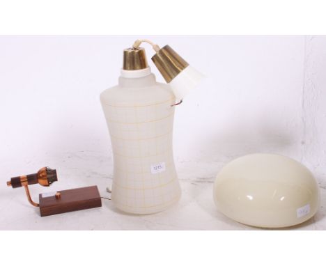 A retro 1950's cylindrical frosted glass shade ceiling lamp together with another.