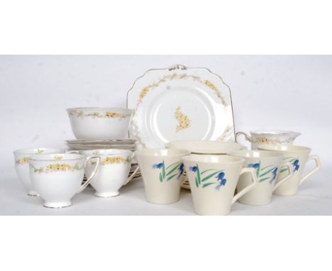 An Art Deco hand painted part tea service along with a part tea service titled ' Fantasia '
