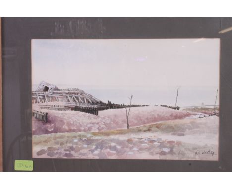 MS Whatley -  An unusual framed watercolour painting of a seascape with fortified ruins being signed to the corner by the art