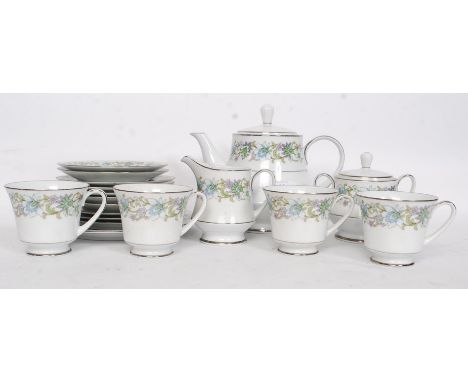 A Noritake 20th century china ceramic part tea service comprising of teapot, cups and saucers. 
