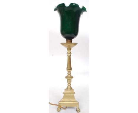 A mid century brass and green glass shade upright bankers lamp. The glass shade being white and green two tone set on brass n